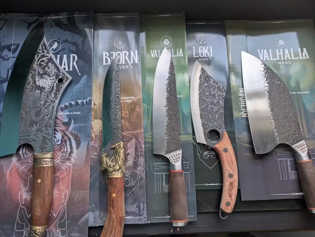 Multiple Northern knives — including Loki, Valhalla, Bjorn, and Ragnar — displayed in their branded boxes, showing different blade and handle designs.