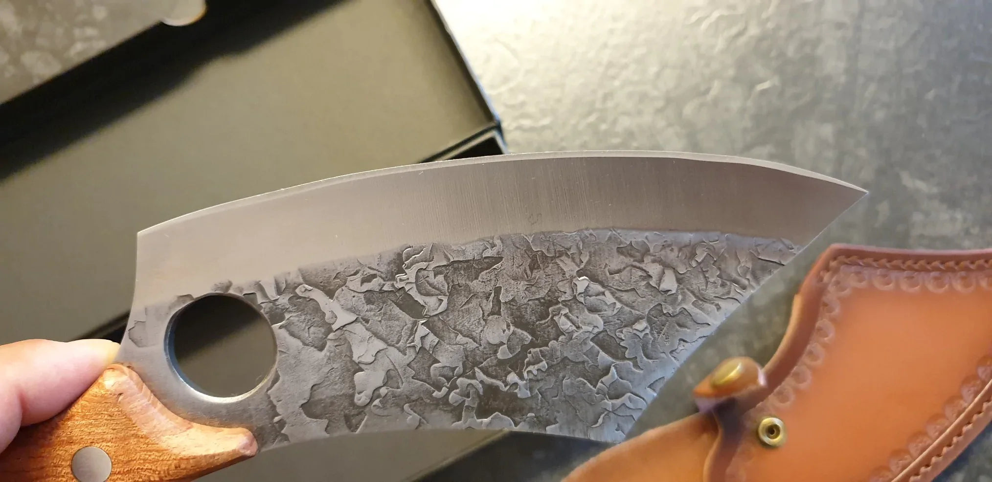 Detailed view of the textured blade and handle of the Loki knife, emphasizing craftsmanship and comfortable control as mentioned in the review.